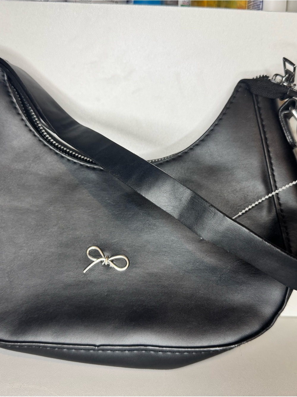 Black Leather Crossbody Bag with Bow Accent